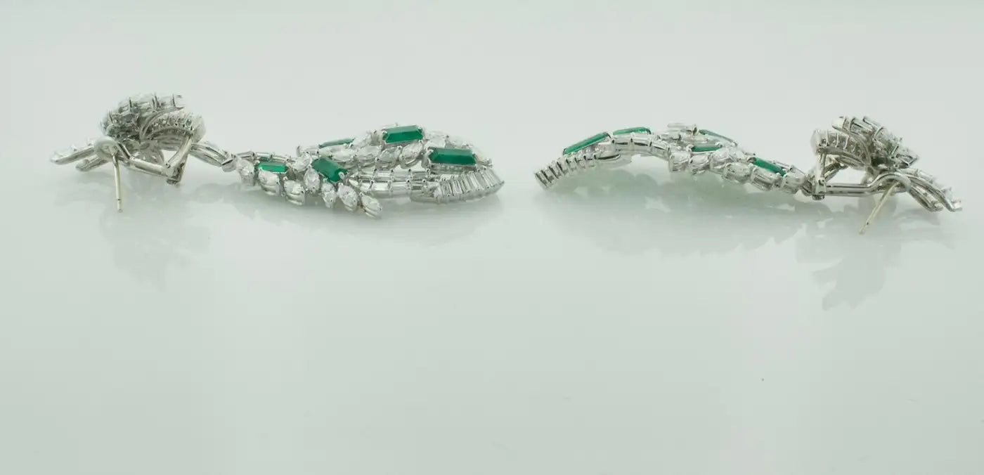 Circa 1950's Dangling Diamond and Emerald Earrings in Platinum