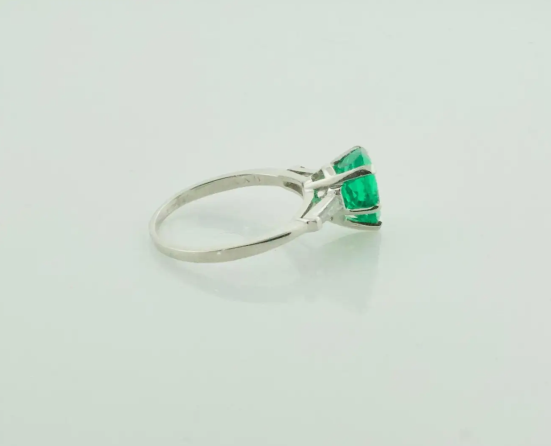 Emerald and Diamond Classic Solitaire Ring in Platinum