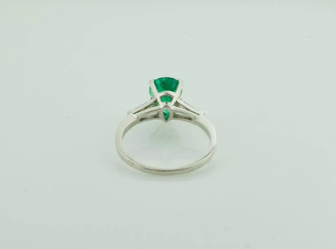 Emerald and Diamond Classic Solitaire Ring in Platinum